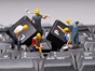 Team of mini figurines repairing a keyboard